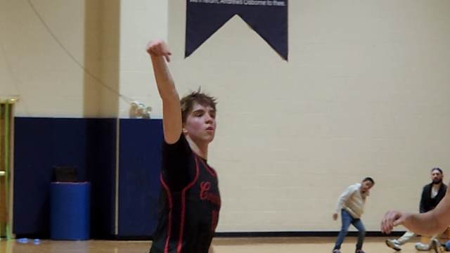 Cornerstone Christian's Quinn Kwasniak watches as a 3-pointer goes in during a win over Andrews Osborne Academe on February 16, 2024.